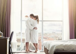 Young couple in love in hotel room in the morning